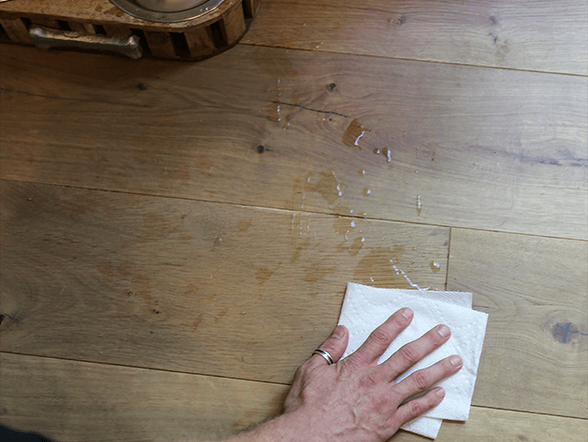 Hand washing a durable wood floor