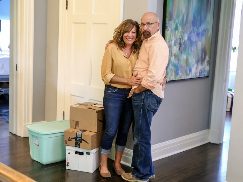 Couple in a home with new hardwood floors